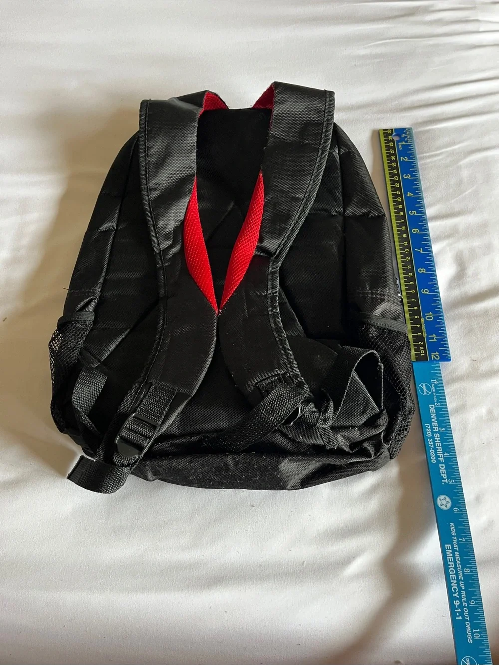 Black & Red Multi-Pocket Backpack with Media Port & Mesh Side Pockets